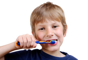 A boy brushing his teeth