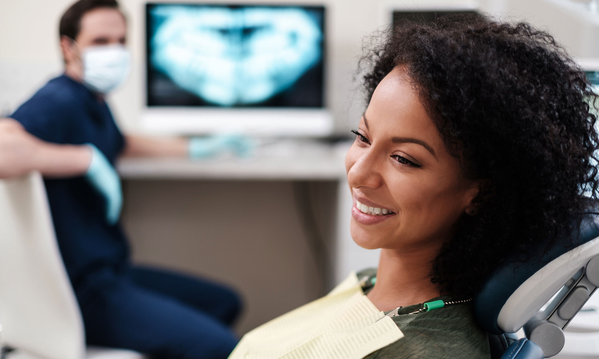 Patient model smiling after an oral surgery procedure