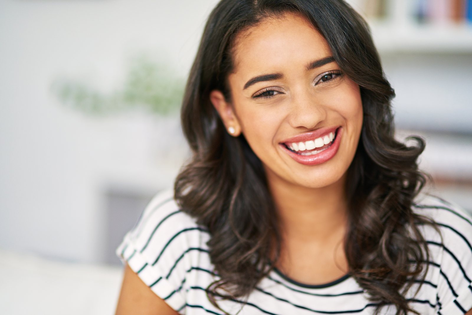 Smiling Invisalign patient at Island Dental