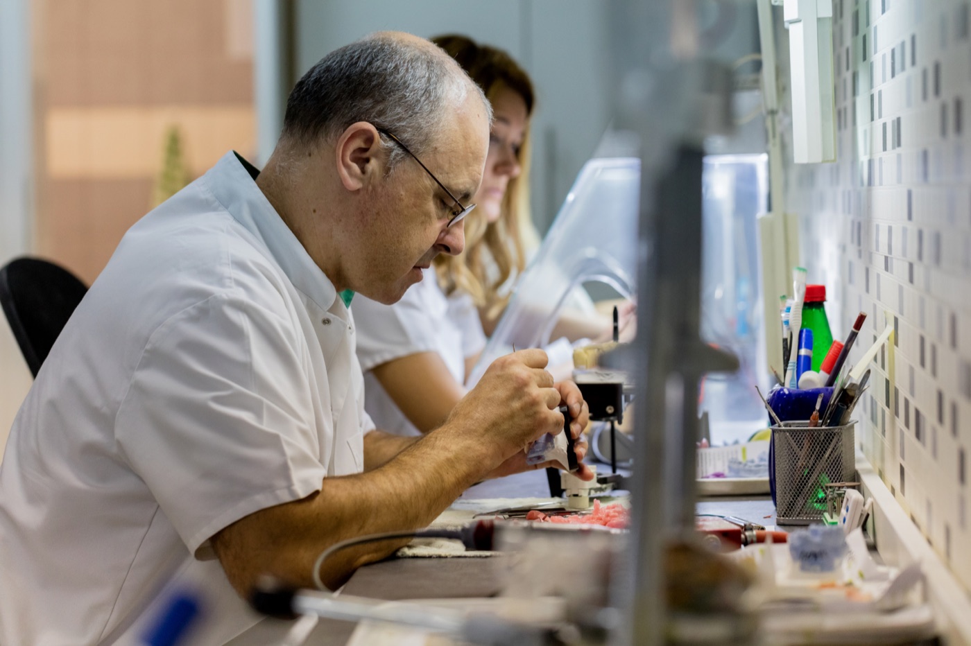 3D printer fabricating dental restorations in the on-site Island Dental lab