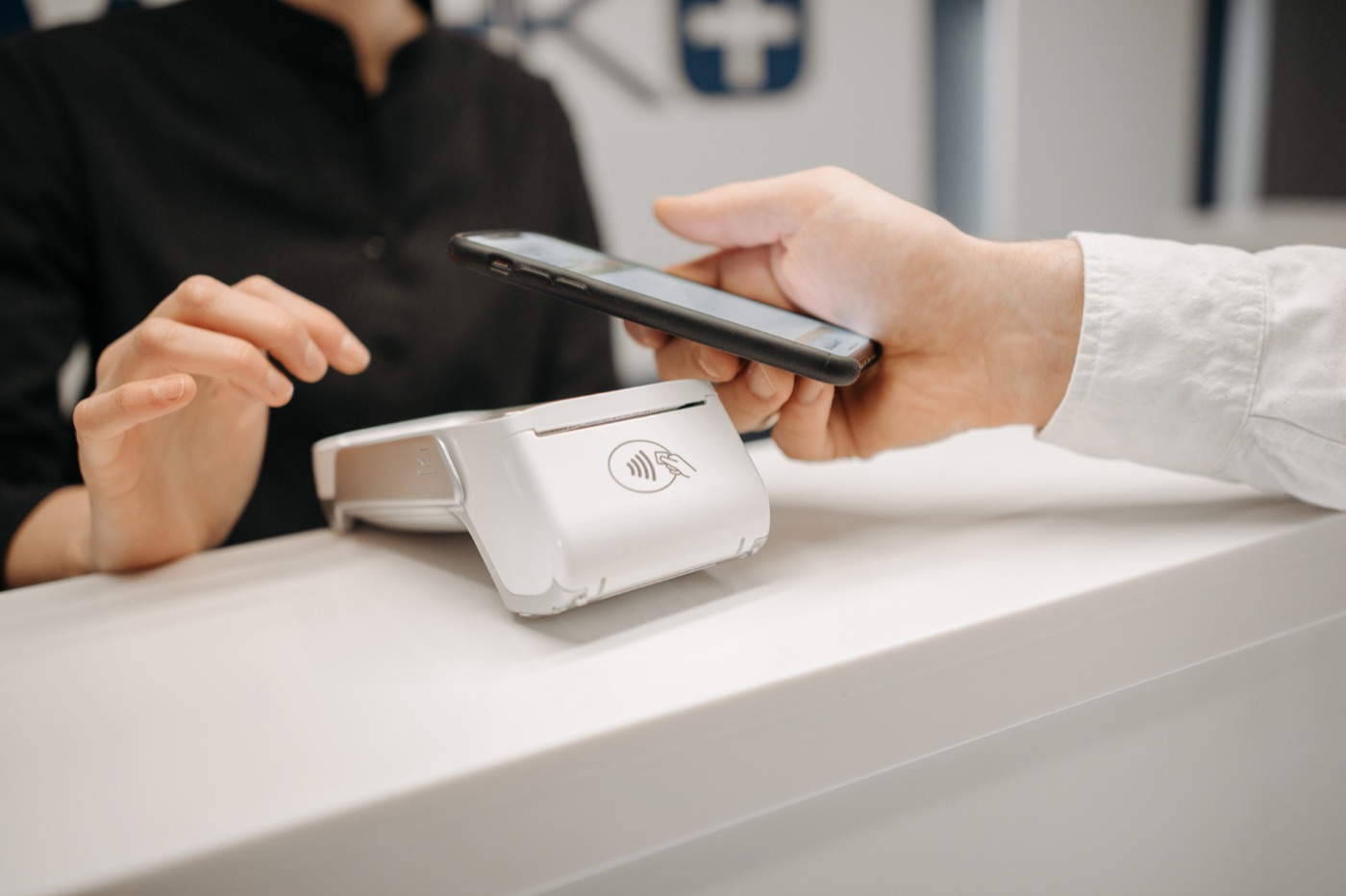 Front desk team member walking a patient through payment options at Island Dental