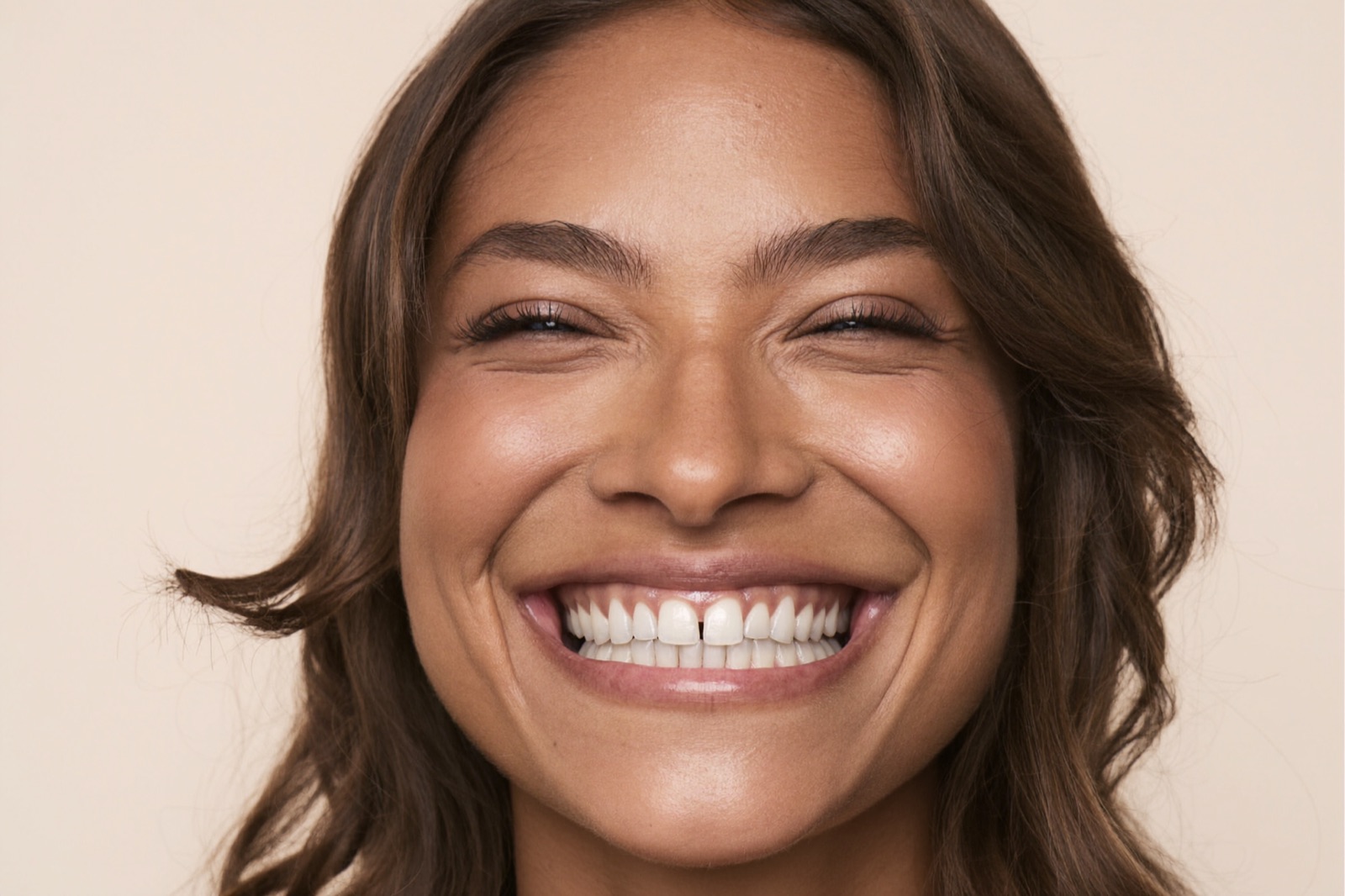 Joyful young woman with a luminous bright white smile