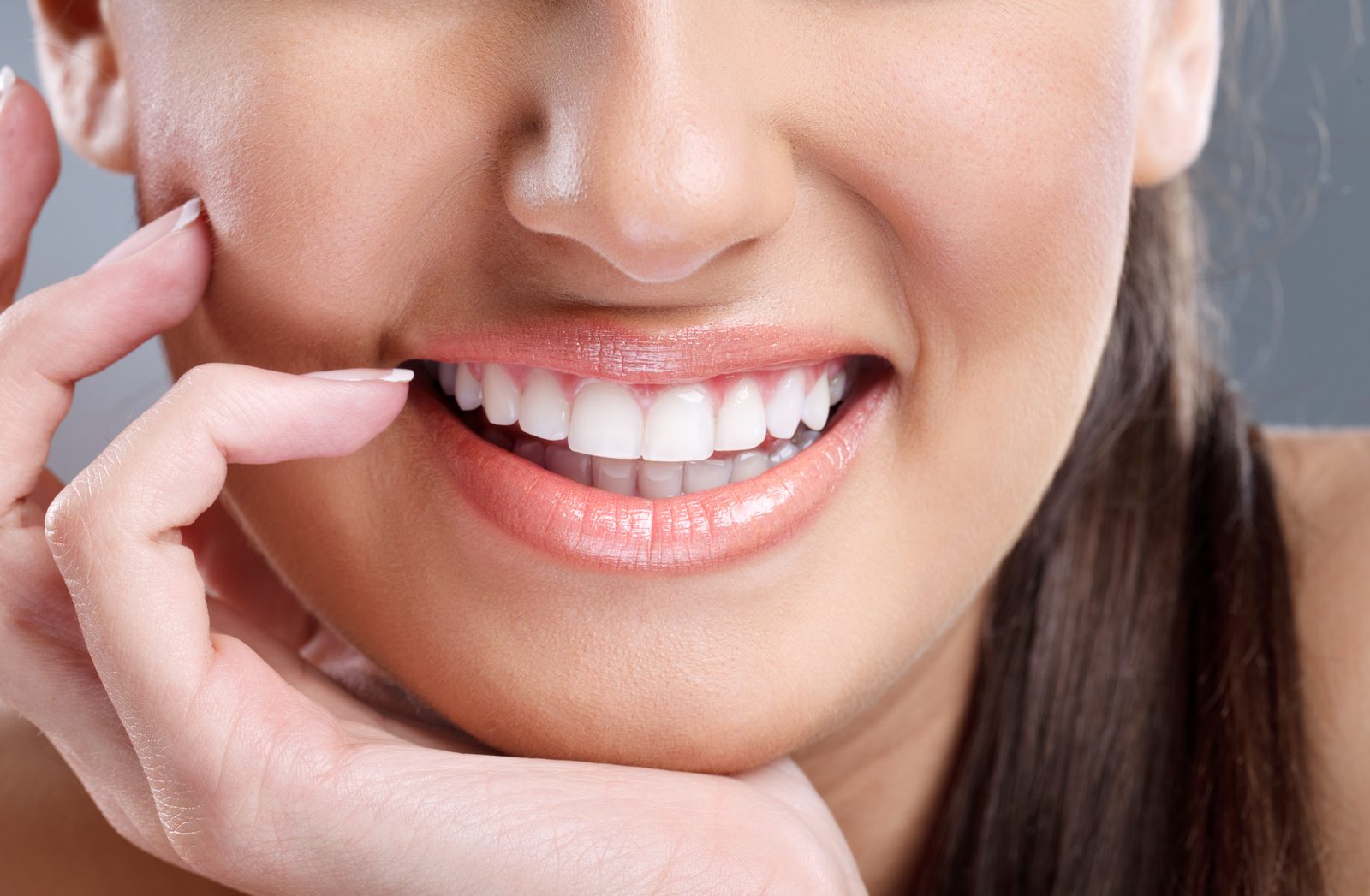 Woman smiling with Invisalign clear aligners